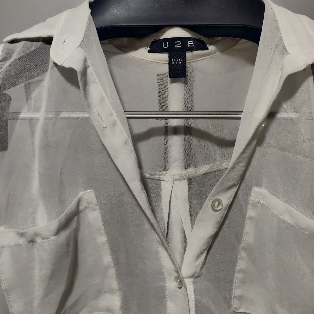 White sleeveless Button up